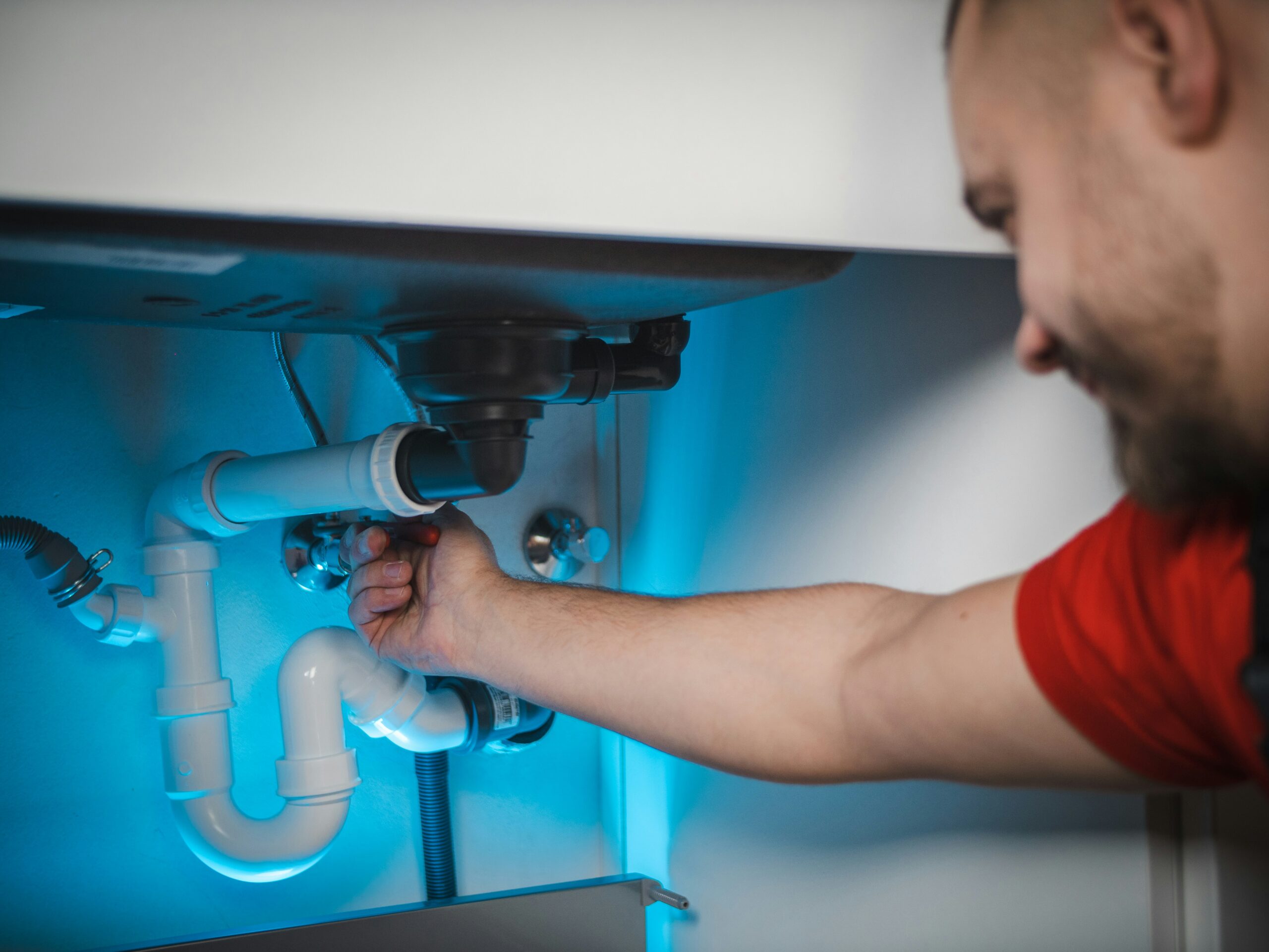 Man working on plumbing