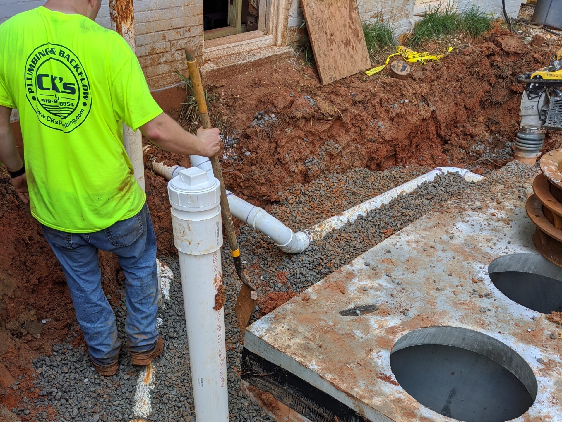 Sewage pump work site with CK's Plumbing Technician